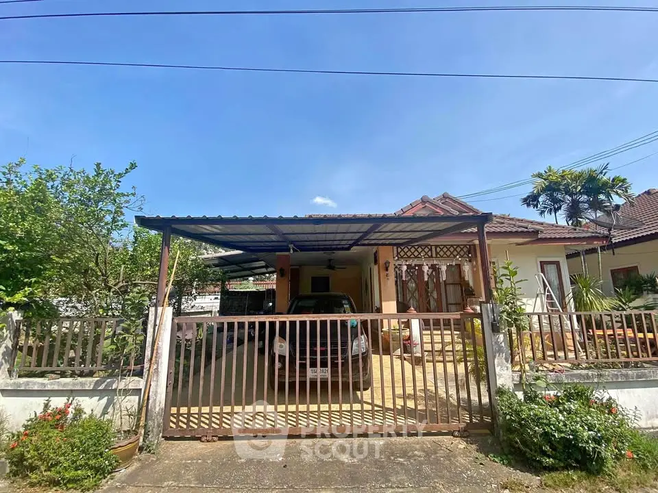 Charming single-story house with carport and lush garden in a serene neighborhood.