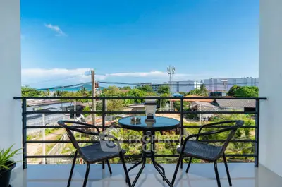 Charming balcony with seating and scenic view, perfect for relaxation and enjoying the outdoors.