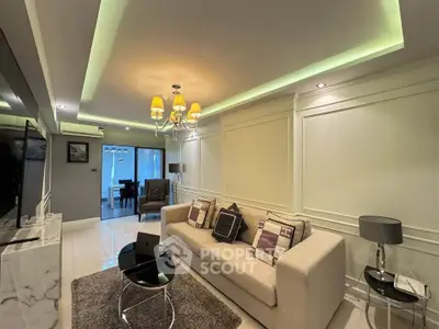Luxurious living room with elegant lighting and modern decor in a stylish apartment.