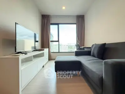 Modern living room with sleek furniture and large window offering a stunning city view.