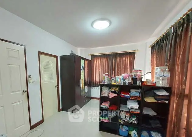 Spacious bedroom with ample storage and natural light