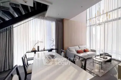 Luxurious modern living room with high ceilings and elegant decor