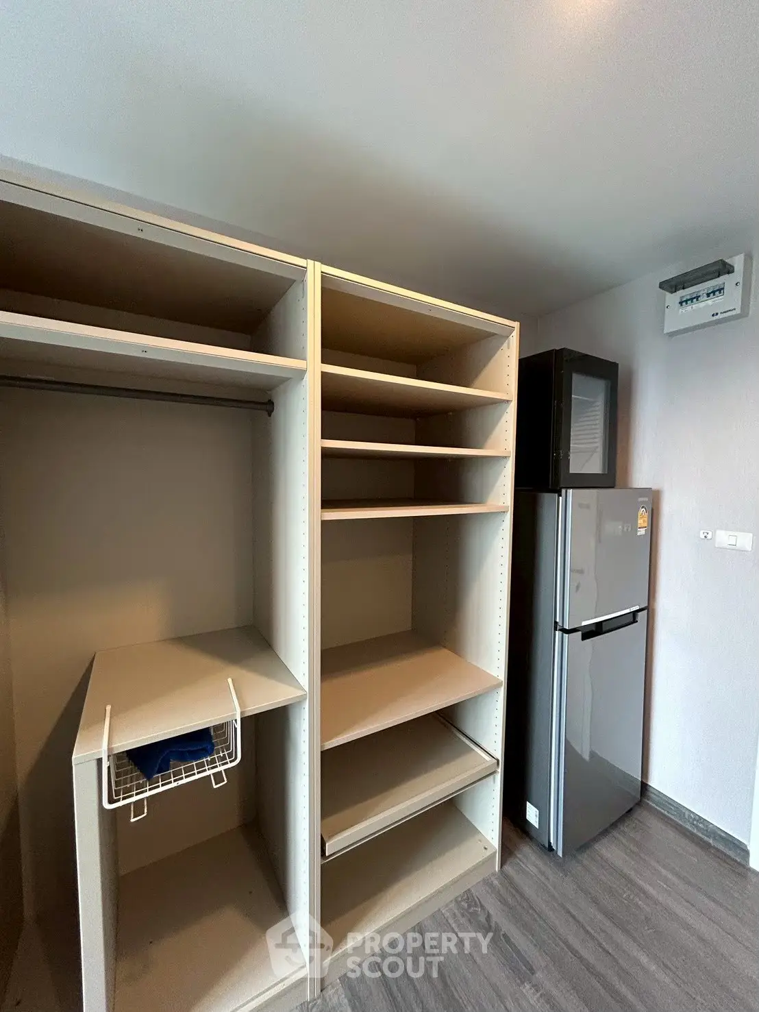 Modern kitchen with sleek fridge and ample shelving space