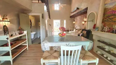 Charming rustic living room with high ceilings and cozy decor