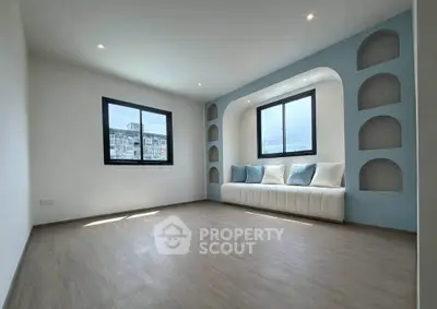 Modern minimalist living room with built-in seating and large windows