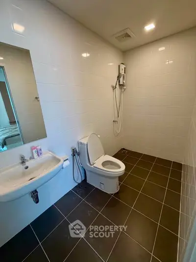 Modern bathroom with sleek fixtures and spacious layout, perfect for contemporary living.