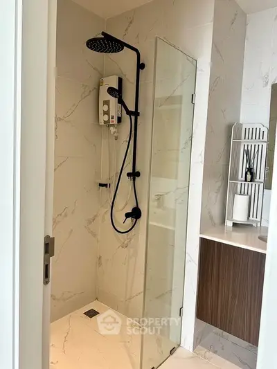 Modern bathroom with sleek shower and elegant marble tiles
