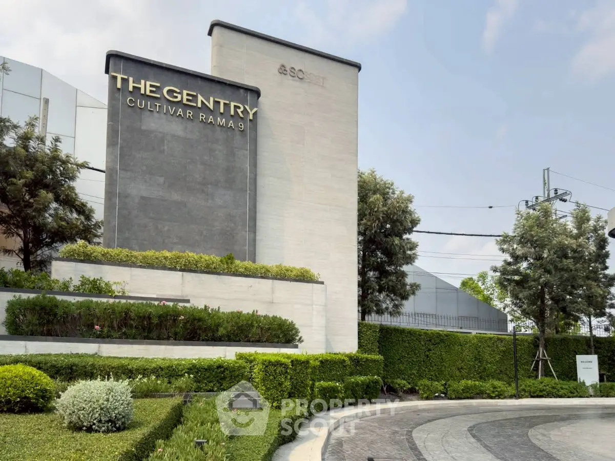 Luxurious entrance of The Gentry Cultivar Rama 9 with lush greenery and modern design.