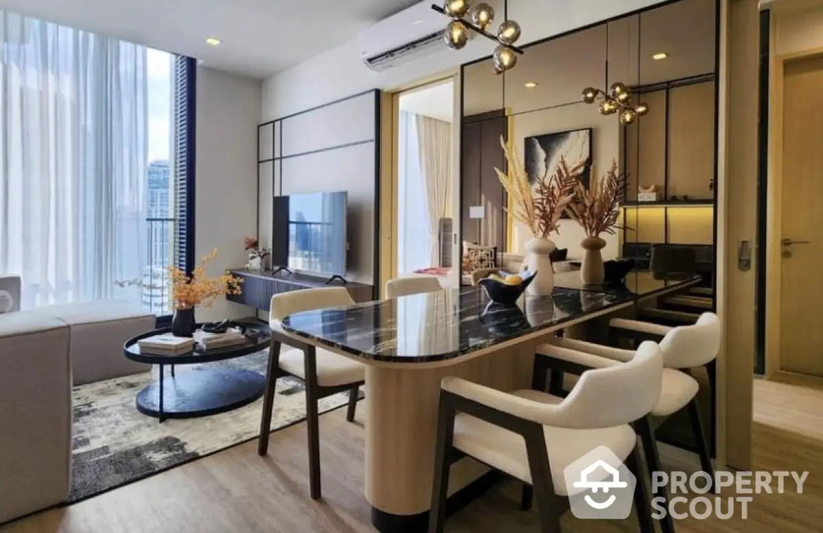 Modern living room with elegant dining area and stylish decor