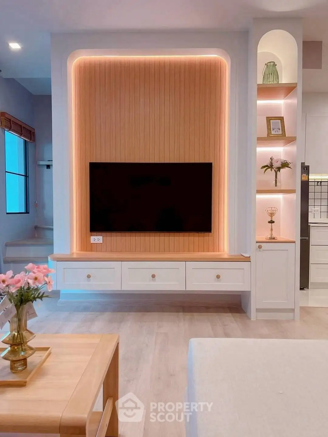 Modern living room with stylish TV unit and ambient lighting