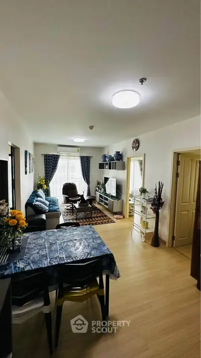 Spacious living room with modern decor and ample natural light