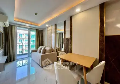Modern living room with elegant decor and balcony view in a stylish apartment.