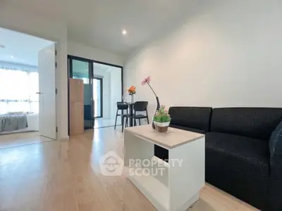 Modern living room with cozy sofa and stylish decor in bright apartment