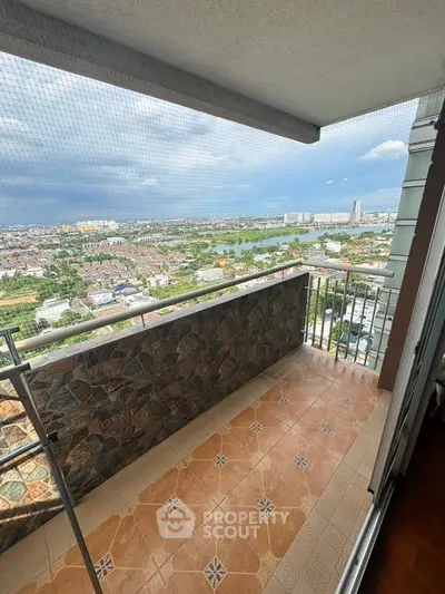 Spacious balcony with stunning panoramic city view, perfect for relaxation and enjoying the skyline.