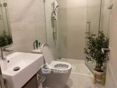 Modern bathroom with sleek design and glass shower enclosure