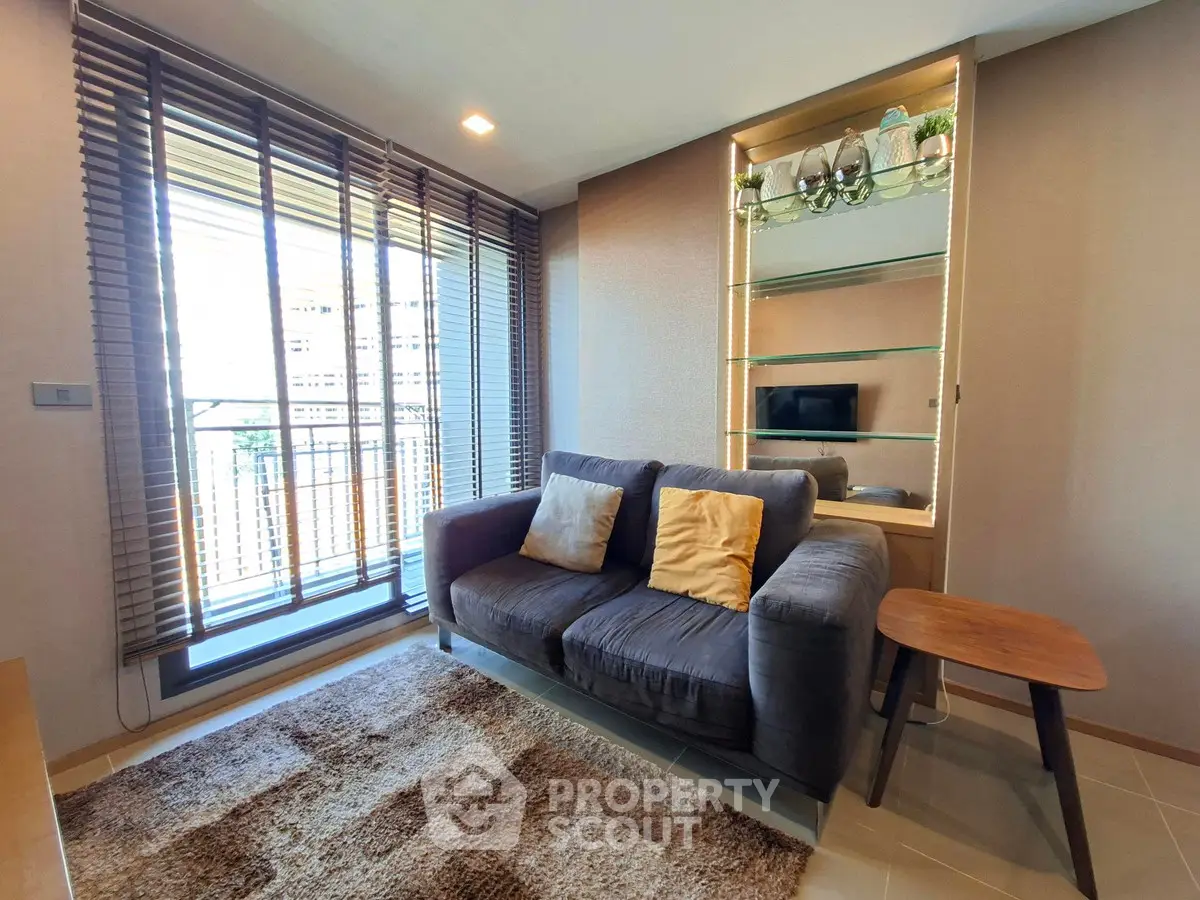 Modern living room with cozy sofa and large window view