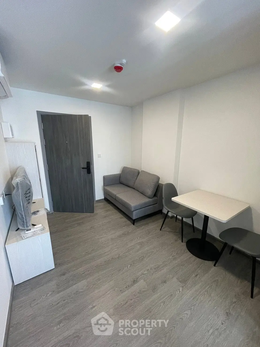 Modern living room with sleek furniture and minimalist design, perfect for urban living.