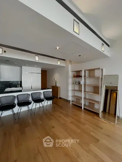 Spacious modern living room with sleek design and wooden flooring