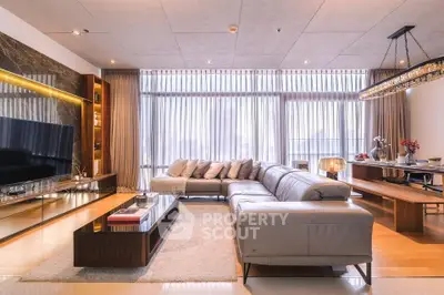 Luxurious modern living room with elegant decor and large windows