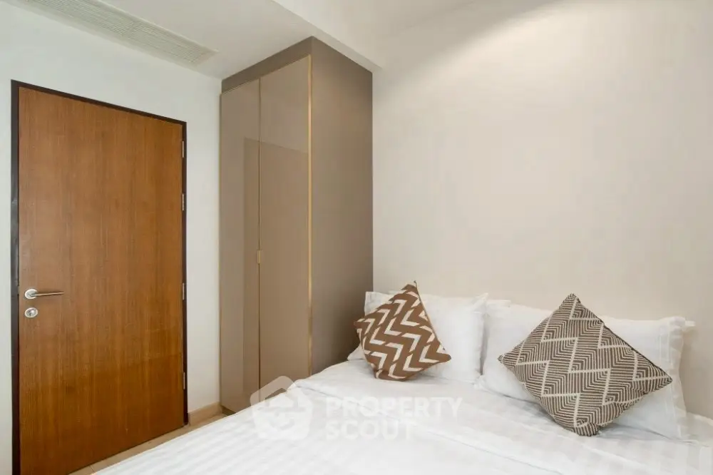 Cozy bedroom with modern decor and stylish pillows