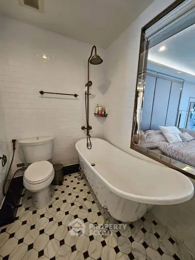 Charming bathroom with vintage clawfoot tub and stylish tile flooring