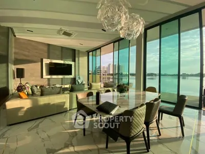 Luxurious living room with stunning waterfront view and elegant modern decor