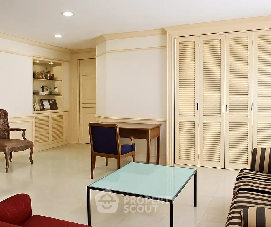Spacious living room with elegant furniture and ample storage space.