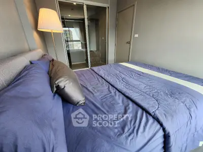 Modern bedroom with cozy bedding and stylish decor in a contemporary apartment