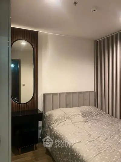 Cozy modern bedroom with elegant decor and stylish mirror