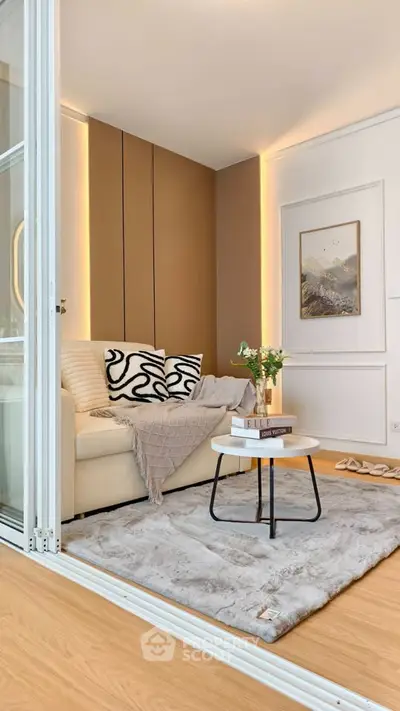 Modern living room with cozy sofa, stylish decor, and elegant lighting