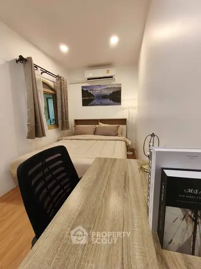 Cozy bedroom with study desk and modern decor