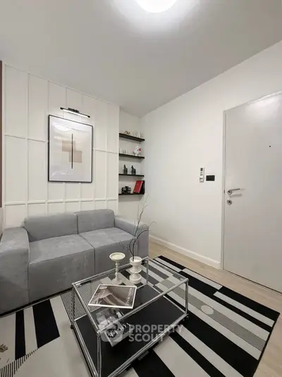 Modern living room with stylish decor and cozy gray sofa