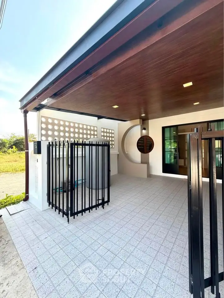 Modern covered outdoor space with stylish ceiling and tiled flooring, perfect for versatile use.