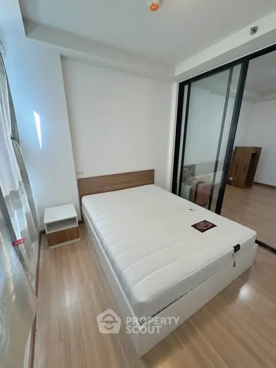 Modern bedroom with minimalist design and large window for natural light