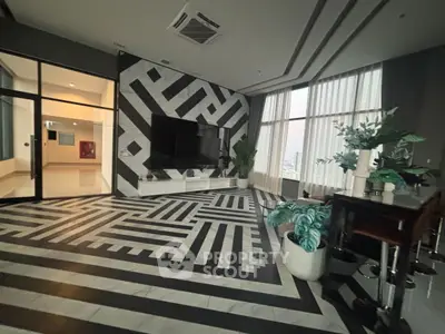 Luxurious modern living room with geometric design and panoramic city view.