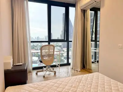 Modern bedroom with city view and stylish decor in high-rise apartment
