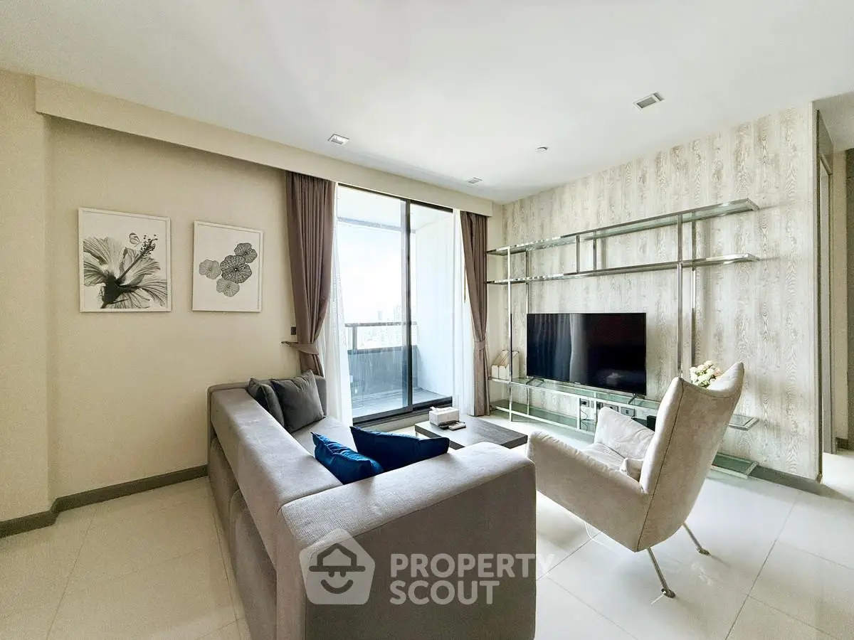 Modern living room with sleek furniture and balcony view