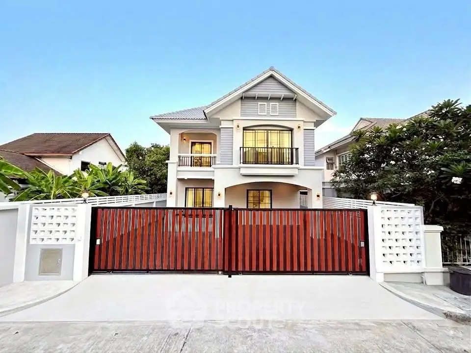 Stunning two-story house with modern architecture and spacious driveway in a serene neighborhood.