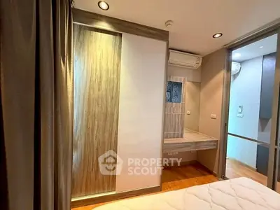 Modern bedroom with stylish wooden accents and built-in wardrobe