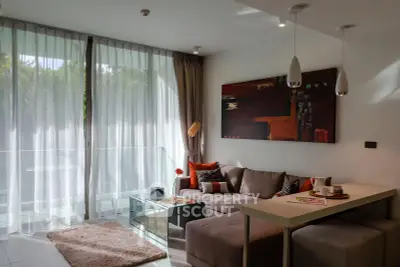 Modern living room with large windows, stylish decor, and cozy seating area in a contemporary apartment.