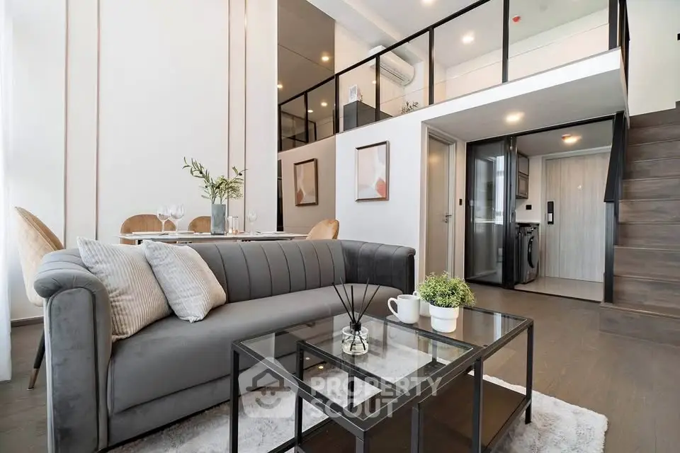 Modern loft apartment with stylish living room and open kitchen layout