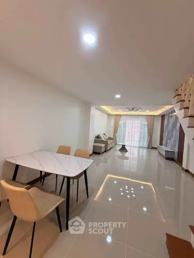 Spacious modern living room with elegant dining area and stylish decor