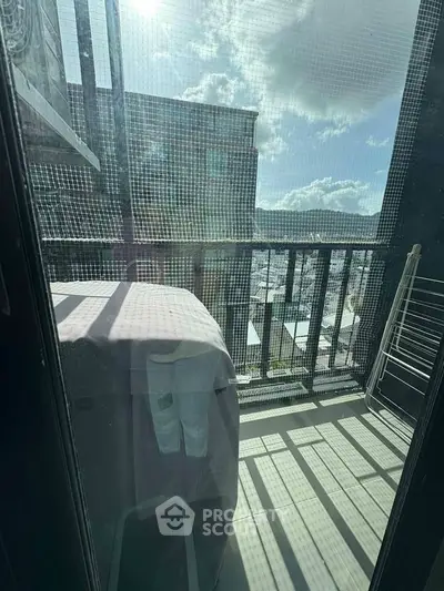 Charming balcony with city view, perfect for relaxation and enjoying the outdoors.