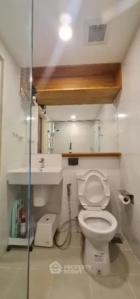 Modern bathroom with sleek fixtures and glass shower enclosure