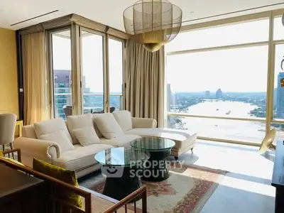 Luxurious living room with stunning river view and elegant furnishings