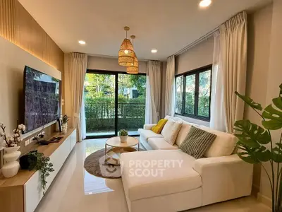 Modern living room with large windows and stylish decor