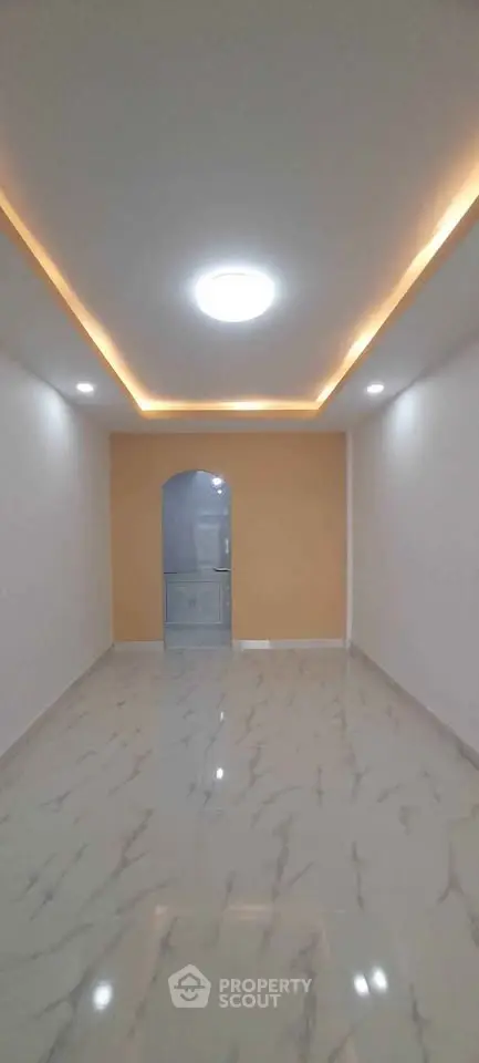 Modern interior with elegant lighting and marble flooring, perfect for stylish living.