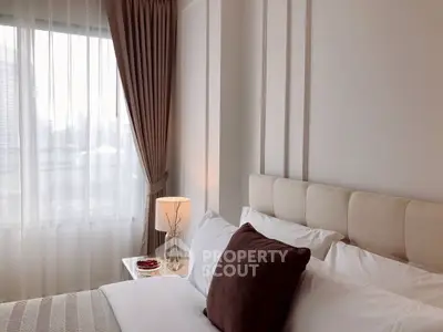 Elegant bedroom with soft lighting and plush bedding