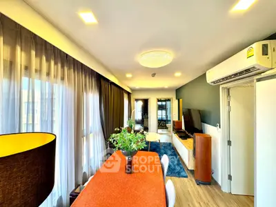 Spacious modern living room with elegant decor and large windows