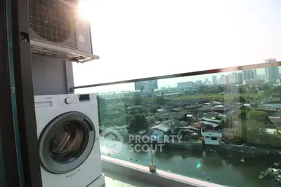 Modern balcony with washing machine and stunning city view over river